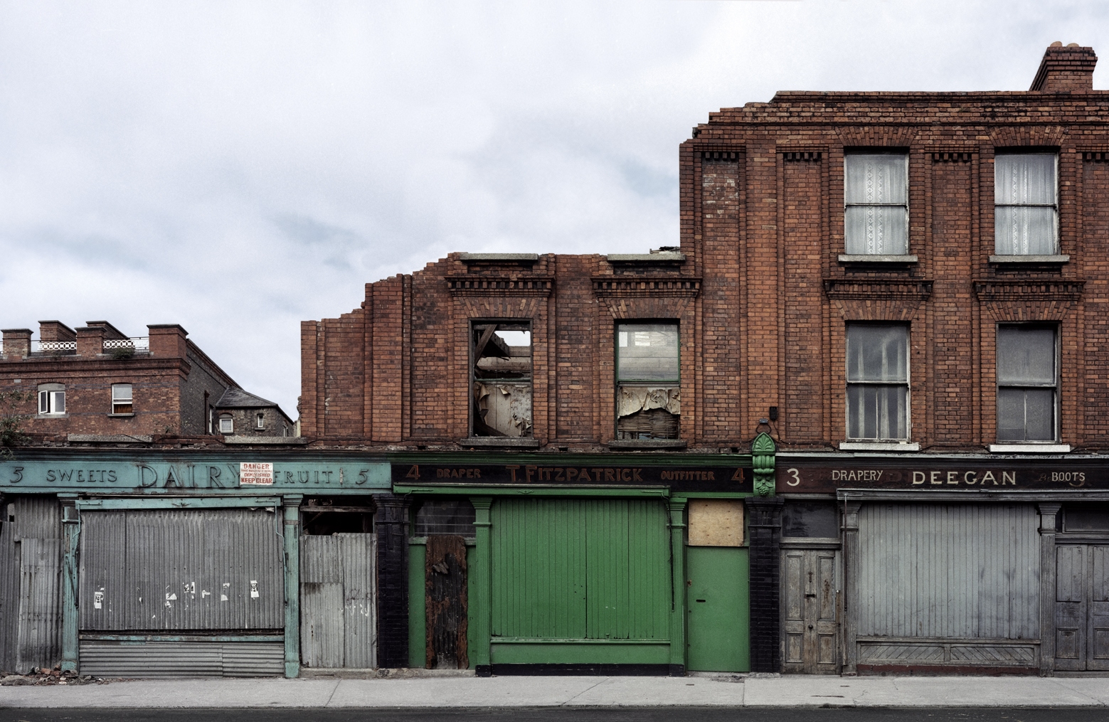 Three abandoned shops on Sarsfield Quay, Dublin 1985 by David Jazay